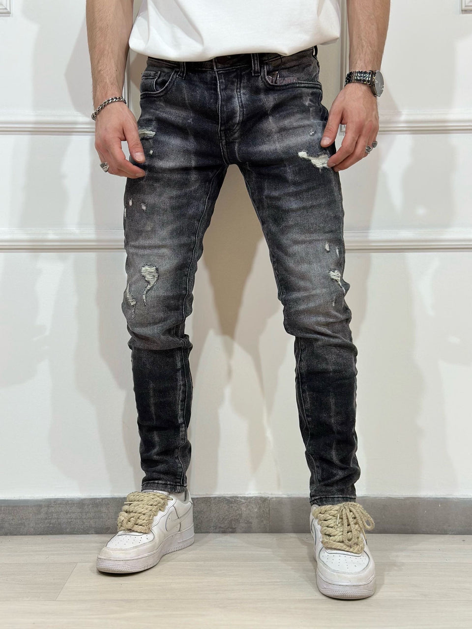 Jeans skinny denim con rotture uomo